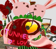 Two rabbits kissing on the Tunnel of Love sign.