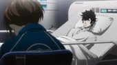 Tsunemori watches over Kogami's hospital bed.