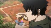 Kogami smoking a cigarette, given by Tsunemori, before going back to the guerrilla base.