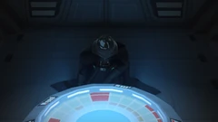 Vader se ajoelha diante do Imperador a bordo de um Destróier Estelar.