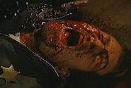 Garvey being stabbed to death in the face by Jester and Blade