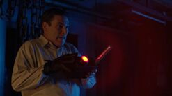 Hauser using his device to control a zombie