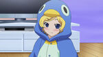 Mion wears her stuffed penguin suit for the sleepover.