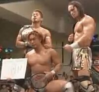 Naruki Doi, Naoki Tanizaki and PAC as Open The Triangle Gate Champions during thier WORLD-1 reign