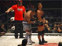 Post Match respect between champion Shingo Takagi and former champion CIMA