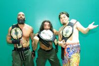 Toru Yano and The Briscoes as the NEVER Openweight 6-Man Tag Team Champions