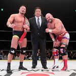 Takashi Sugiura and Michael Elgin posing with Riki Choshu after the inaugural championship match