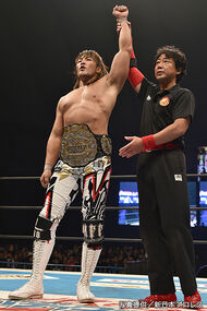 Hiroshi Tanahashi, a Japanese man with long brown hair, at a professional wrestling event