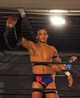 Ricochet as one of the Open the Triangle Gate Champions in 2011