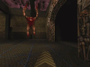 E1M3: The Necropolis nearby end level portal. The player carries super nail gun.