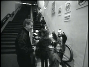 Some audience members on the escalator