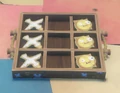 A game of Tic-Tac-Toe on a Table.