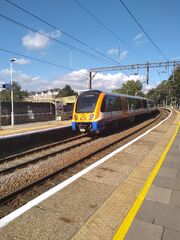 Class 710 departing Wood Street