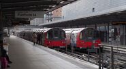 Two Jubilee Line 1996 Tube Stock trains awaiting departure at Stratford