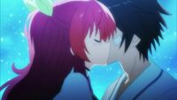 Stella kissing Ikki in the cheek