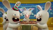 Two Rabbids are holding a plate of pretzels