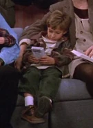 The Staring Kid playing Game Boy in "Debra's Sick"