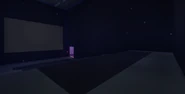 The theater in one of the Quiet Structures, possibly Movie Night.