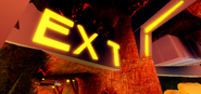 The "EXIT" sign with a missing letter "I".