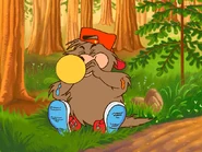 Spike the Porcupine is blowing balloons for the party...