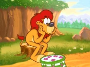 Suddenly, he sees a cake moving along the path in front of him, being carried by mice.