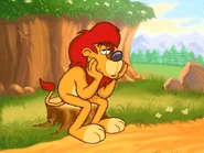 Sam is sitting on a tree stump, looking bored.