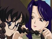 Nancy braids Yomiko's hair as they discuss love.