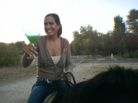 Jo on a horse with a Martini glass