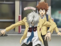 Gokudera protecting Tsuna.