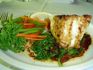 Chilean sea bass with garlic, basil and vegetables