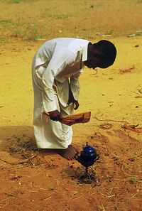 African Kid Making Tea