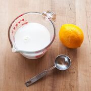 Buttermilk next to the lemon and the tablespoon