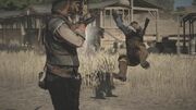 John Marston shooting an outlaw with the Pump-action Shotgun.