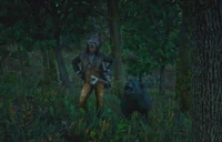 Arthur Morgan posing in his Bear Hunter Outfit with a Black Bear