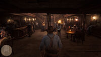 Arthur entering a saloon