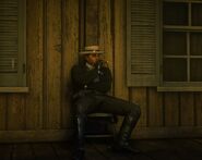 Tom waits for players near the Van Horn stables