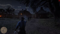 Arthur in the middle of a gunfight at Caliga Hall