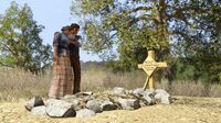 Abigail and Jack mourning by John's grave