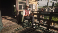 Trelawny sitting on his caravan's porch