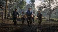 Van der Linde Gang members on the streets of Valentine. From left to right, Javier Escuella, Sadie Adler, Arthur Morgan, Sean MacGuire and Bill Williamson