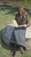 Sadie reads a book at Horseshoe Overlook