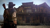 John Marston approaching the saloon