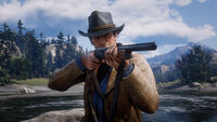 Arthur ready to fire a shotgun