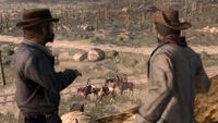 Norman pointing his gun at Marston and his allies.