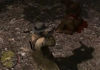 Marston standing over the dead body of a Sasquatch.
