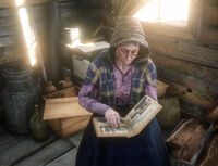 Mama Watson looking at her scrapbook