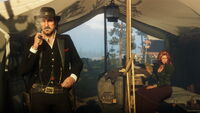 Dutch standing at his tent alongside Molly with a beta hair model