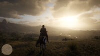 Arthur and his horse on the top of a hill looking out over the vast landscape