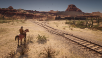 Arthur Morgan observing a train in New Austin seen via glitch