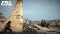 Woody Swenson, alongside Dale Chesson and other members of Walton's Gang, about to get ambushed by John Marston.